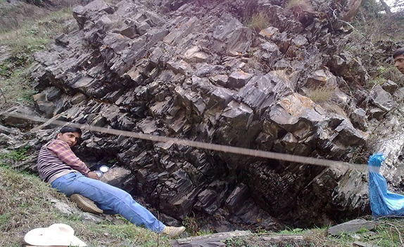 Geologist taking structural data, basemental field Buniyar, Baramulla